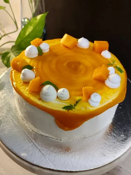 Celebrate Dad with a cake that's just for him. This Father's Day cake features a fun tic-tac-toe design, showing him he's a winner. Whether it's a simple mango cake or a rich chocolate one, it's a sweet way to show you care.