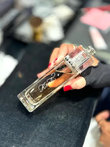 A close-up of a personalized Dior fragrance from a live event. The ability to deliver clean, beautiful engraving on the spot is a skill I've honed over many years and countless events.