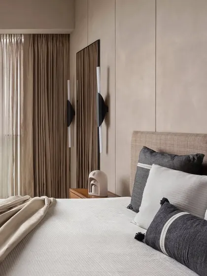 Another view of the East Coast Residence bedroom, where a full-length mirror is cleverly placed to reflect light and create a sense of spaciousness.