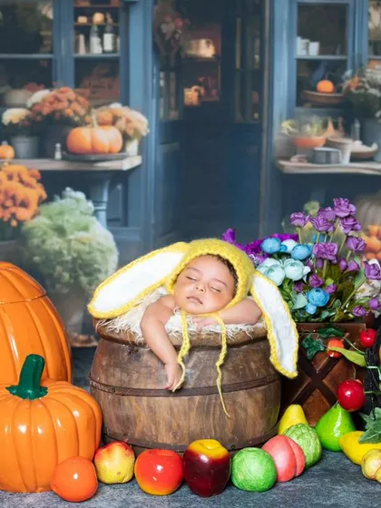 Another sleepy newborn at the market, this time in a bunny hat.