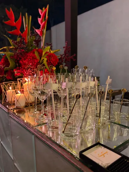 Our bar is always impeccably set with beautiful glassware, custom stirrers, and elegant floral arrangements. We ensure every detail is perfect before the first guest arrives.