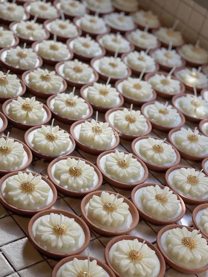 A large batch of our earth pot daisy candles, a beautiful and sustainable gifting option for any festive occasion.
