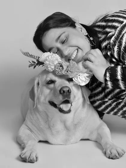 For Mother's Day, I do simple, classic black and white portraits that focus on the bond between a mom and her fur baby. This moment with a beautiful Labrador and her flower crown is just pure joy.