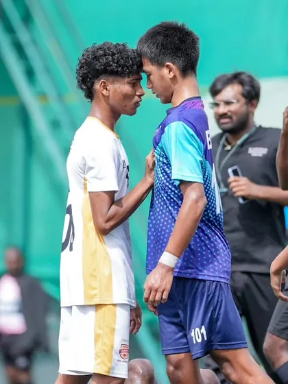 The heat of competition. An intense face-off between our player and an opponent, showcasing the passion and fight we bring to every game.