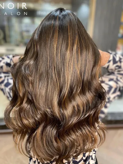Another angle of this gorgeous brunette balayage. You can see how the light catches the different tones, creating a rich, dimensional effect.