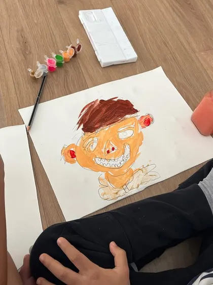 This self-portrait has so much character. We encourage children to go beyond a simple likeness and capture a feeling or a mood.