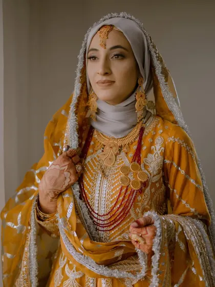 A beautiful portrait of the Muslim bride, Insha, looking elegant and poised in her traditional wedding attire.
