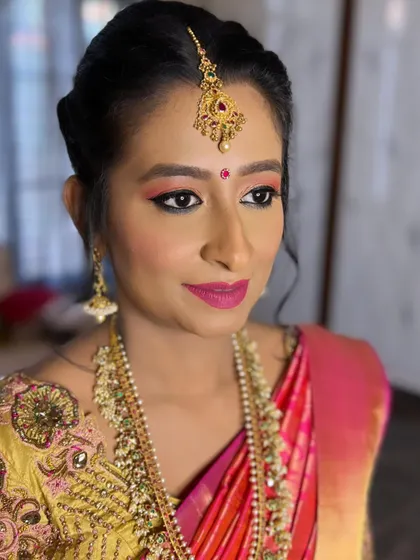 A three-quarter view showing how the makeup enhances her profile, with a focus on glowing cheeks and well-defined eyes.