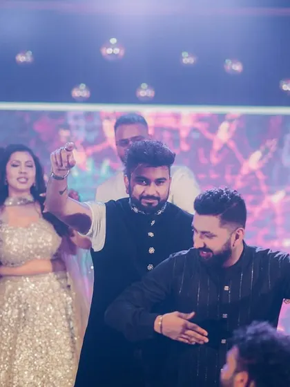 The groom and his friends enjoying the dance performances at the Sangeet.
