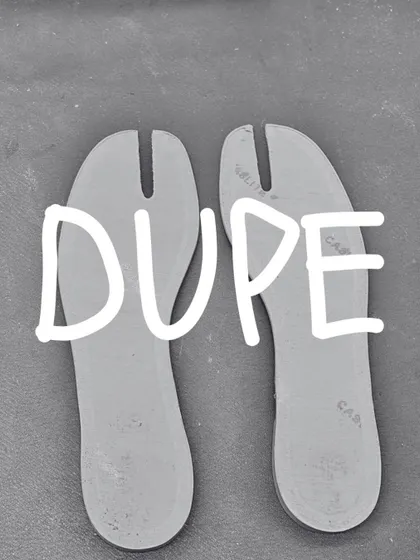 The split-toe insoles for the 'DUPE' Tabi flat, laid out before being placed in the shoe. Every component is carefully considered and crafted.