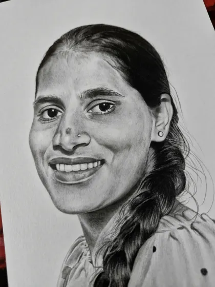 A portrait of a woman with a simple, warm smile and a traditional braid. My goal is to capture the essence of the person.