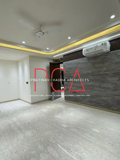 A duplicate of image 166, showing the modern, geometric wall paneling in one of the rooms at the Vasant Kunj residence.