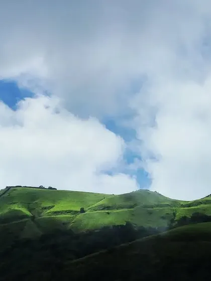 Sunlight breaking through the clouds to illuminate a bright green hilltop in the Western Ghats. I am always searching for these beautiful moments of light in nature.