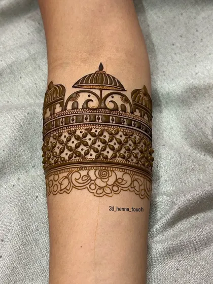 The arm band design taking shape, with the addition of a delicate floral border. The fine dot work adds a beautiful texture to the overall pattern.