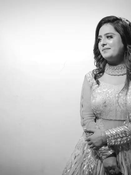 A beautiful black and white portrait of the bride-to-be on her engagement day. The simple background and soft lighting put all the focus on her.