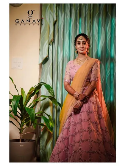 A beautiful pink engagement lehenga featuring delicate all-over embroidery. The soft color palette and graceful silhouette make it a romantic and elegant choice for a special ceremony.