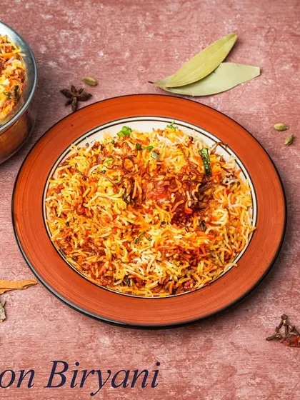 Our Mutton Biryani features succulent pieces of mutton slow-cooked with fragrant basmati rice and a rich blend of whole spices. It's a hearty and aromatic dish, perfect for any celebration.