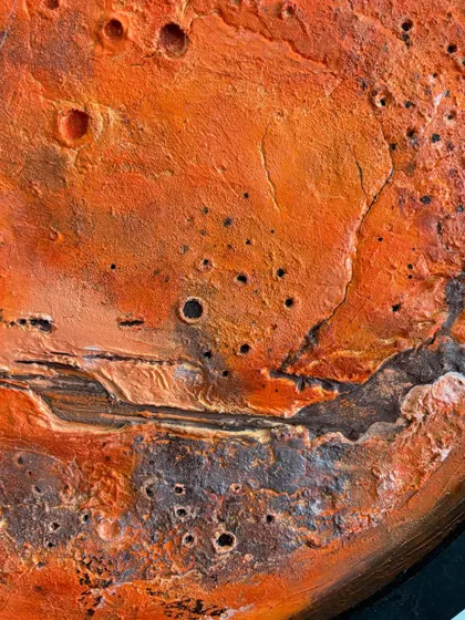 An extreme close-up of the texture on the Mars lamp. Every crater and ridge is carefully sculpted and painted to create a highly detailed and realistic piece of planetary art.