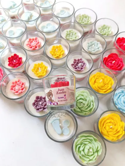 Another view of the colorful and varied votive candles, with a personalized one for "Juan Zandro's 1st Birthday" in the center.