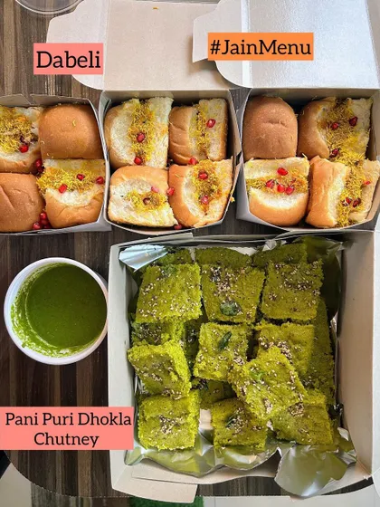 A popular combination for parties: soft Jain Dabeli and flavorful Pani Puri Dhokla, served with a fresh green chutney.