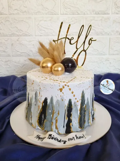 A popular design for milestone birthdays like 50th or 60th. This cake uses a palette knife technique with black, white, and gold, topped with dried botanicals for a rustic yet modern feel.