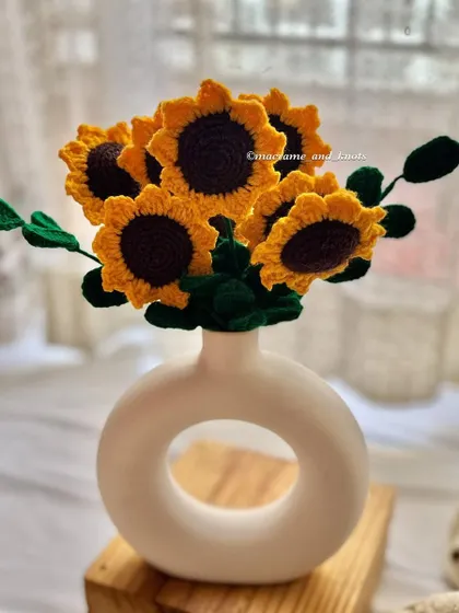 A bouquet of my crochet sunflowers in a modern donut vase. Flowers are love's truest language.