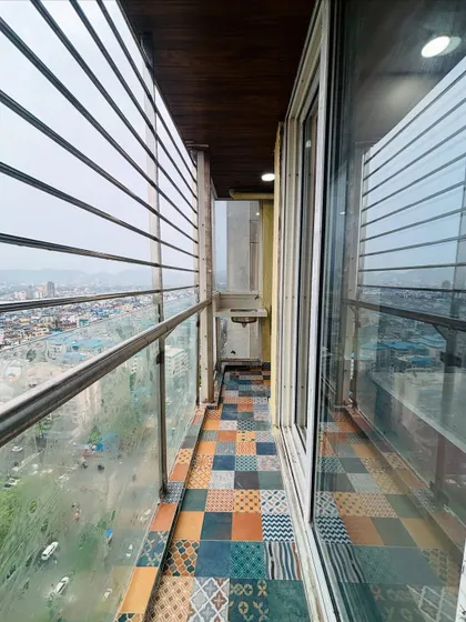 For this balcony, I used colorful and patterned Moroccan-style tiles to create a vibrant and cheerful outdoor space.