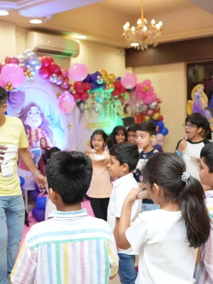 A group of kids listening intently for the next instruction. A well-hosted party is an organized and fun party.