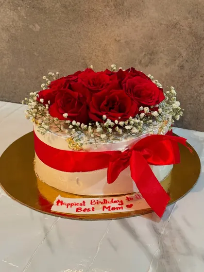 This cake is designed to look like a beautiful bouquet of fresh red roses and baby's breath. It's a wonderfully romantic gesture for an anniversary, Valentine's Day, or a mother's birthday.
