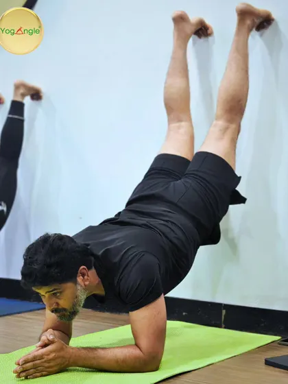 Power in the pose, calm in the heart. This student demonstrates incredible strength and focus holding a forearm stand against the wall, inspiring everyone in our community.