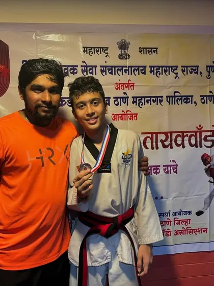 Posing with my student Asit Brahmane after he won a gold medal at the DSO competition. Moments like these, seeing the pride on their faces, are my biggest reward as a coach.