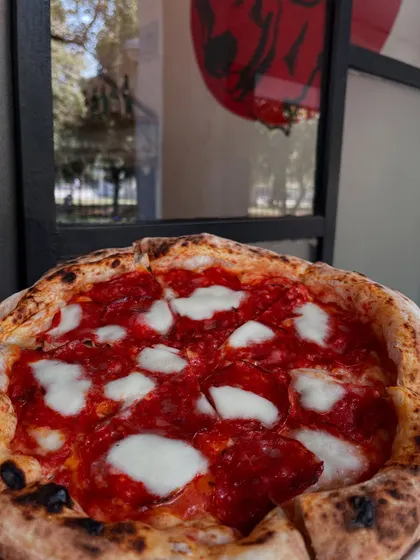 Our pepperoni pizza enjoying some sun. It's a perfect meal for any time of day.