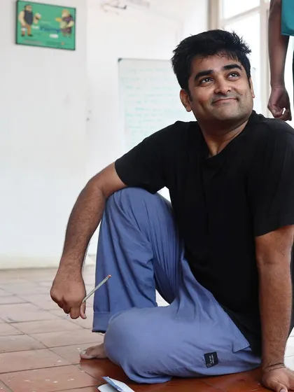 An actor sits on the floor during a "Gretel" rehearsal.