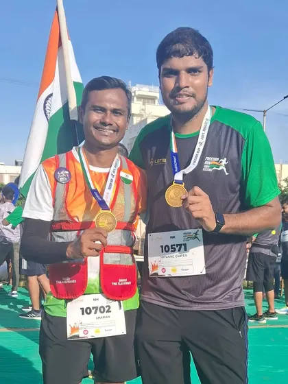 Two runners with their medals after the Freedom Run. Our events are a great opportunity to meet and connect with fellow members of the running community.