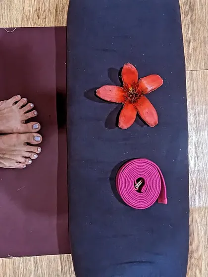 A simple moment before practice. My feet on the mat, a strap, and a beautiful flower. Taking a moment to appreciate the small details helps bring mindfulness and gratitude to our yoga practice.