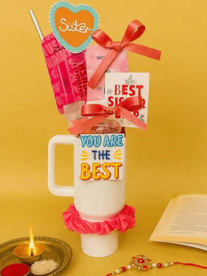 A sweet and simple mug hamper for the 'Best Sister'. It's filled with little treats and accessories, all bundled together to make her feel special.