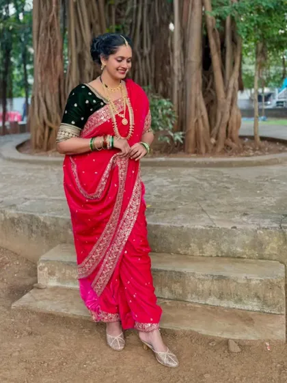 Embrace Maharashtrian heritage with this stunning pink velvet Nauvari saree. The traditional drape, combined with rich fabric and authentic jewelry, is a powerful statement of grace and cultural pride.
