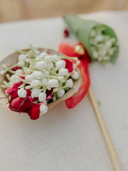 Small cones of fresh flowers for guests to shower the couple with blessings during the ceremony.