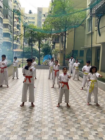 Students at our Purva Belmont dojo practice their basic stances and punches in an outdoor session. Strong Kihon is the key to progress in both Kata and Kumite.
