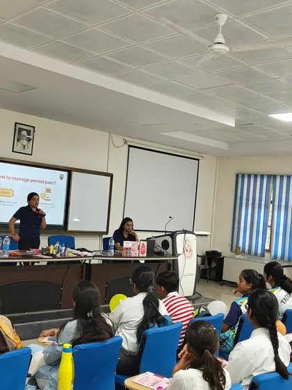 A facilitator leads a session at Banaras Hindu University, explaining how to manage period pain to a classroom of engaged students. Our workshops are designed to be interactive and provide practical solutions.