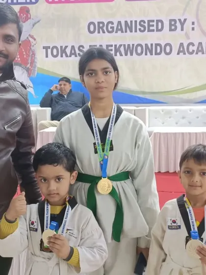 My students showing off their medals after a successful tournament. We train boys and girls to become strong, confident players.