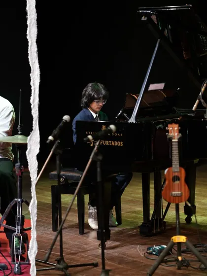A collage capturing a young pianist at the grand Steinway and a ukulele waiting for its player. The stage at 'Joie De Vivre' was set for moments of musical magic.