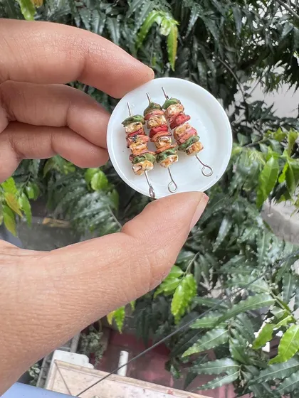 Can you name this snack? These miniature paneer tikka skewers look good enough to eat, but they are actually handmade clay magnets.