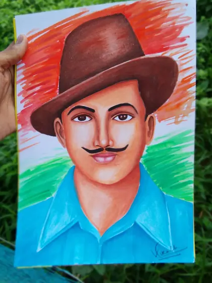 The completed oil pastel drawing of Bhagat Singh, held outdoors. The colors appear vibrant against the tricolor-inspired background.
