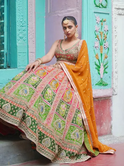 Lehengas fit for royalty. This multi-colored lehenga with traditional block-print style embroidery is a unique and artistic choice for any bride.