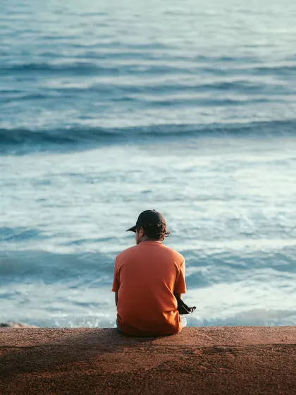 The art of cropping. This image of a person looking out at the sea in Colombo is simple yet evocative, focusing on the feeling of solitude and contemplation.