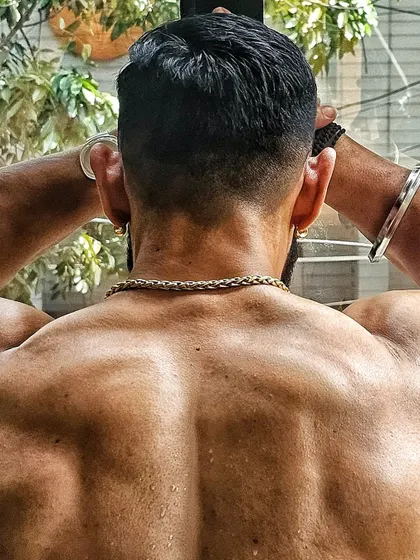 Close-up detail of the muscles in my back. This level of conditioning is the result of a strict diet and a relentless training schedule.