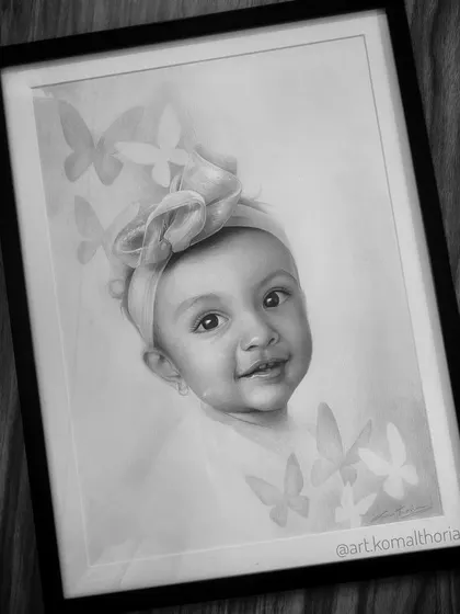 The final framed portrait, showing how the soft butterfly background adds a touch of magic to this baby portrait.