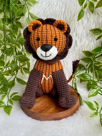 A unique lion created from a child's drawing! I love bringing your creative ideas to life. This striped lion with the initial 'M' is a truly one-of-a-kind creation.