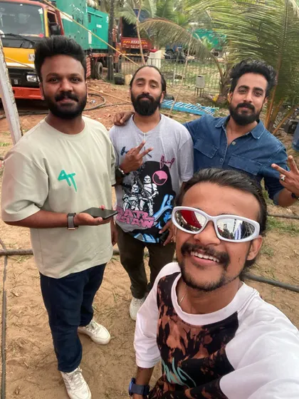 A candid selfie with the crew during a daytime event setup.